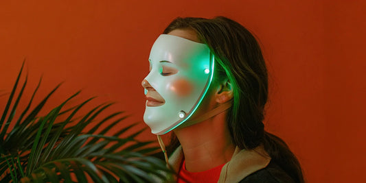 Woman using a top-rated LED mask for wrinkles and anti-aging.